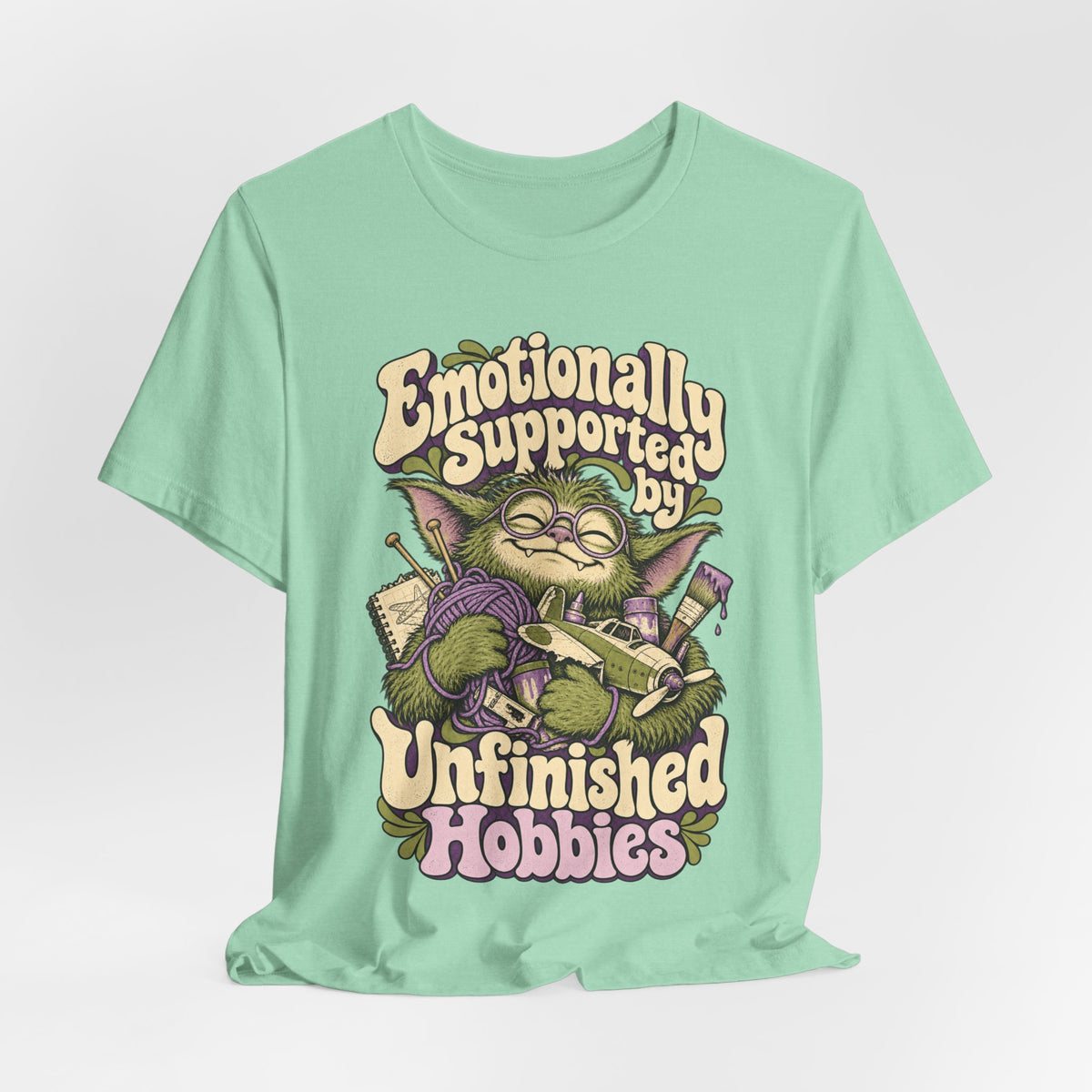 Emotionally Supported by Unfinished Hobbies — Unisex Tee