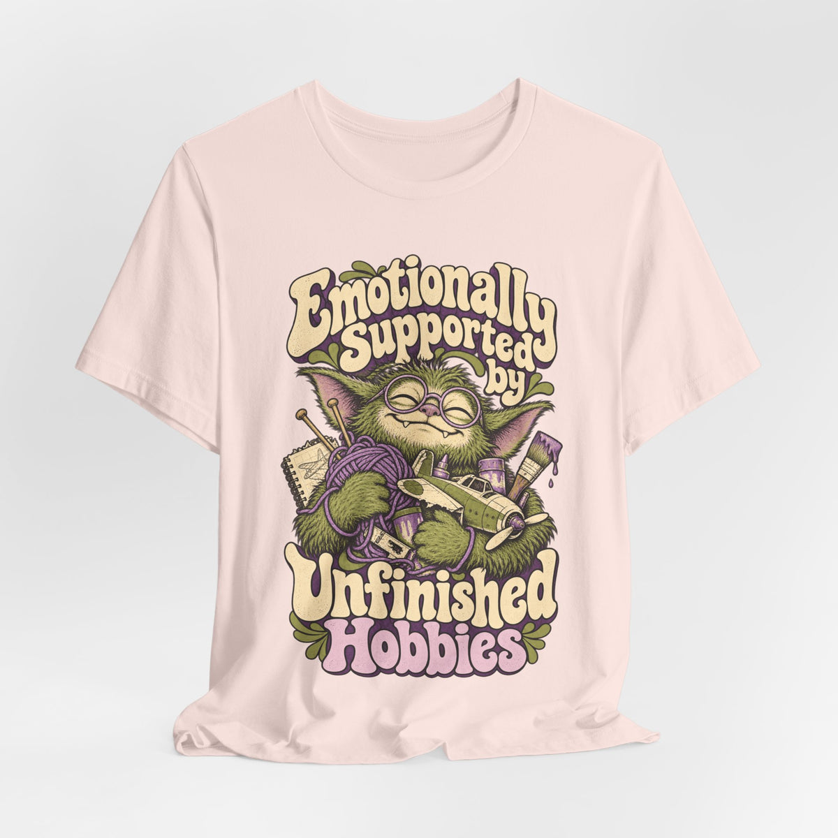 Emotionally Supported by Unfinished Hobbies — Unisex Tee