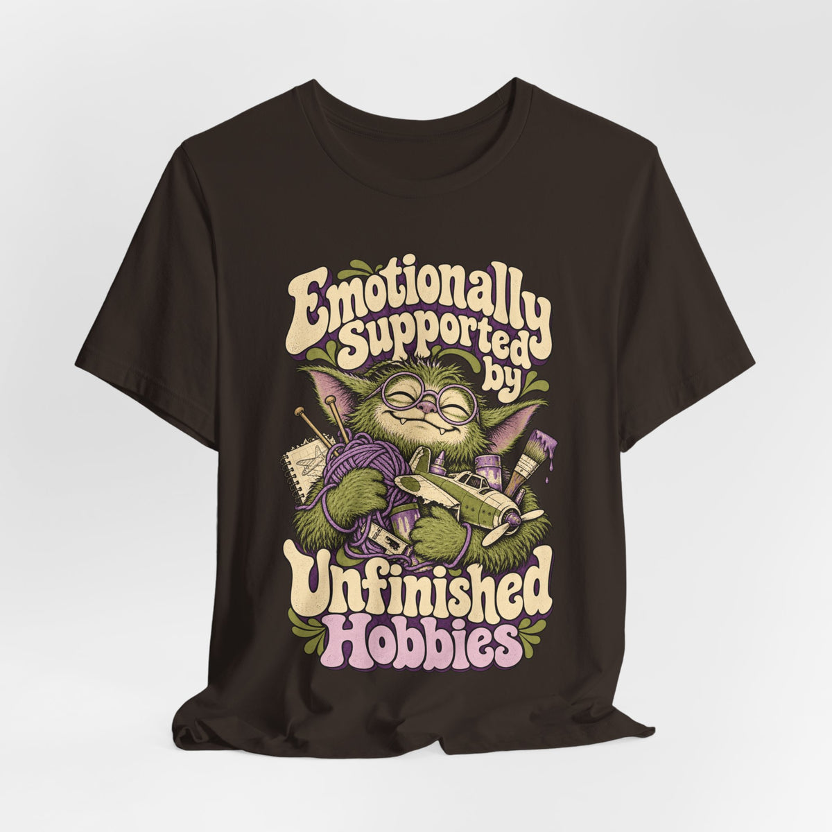 Emotionally Supported by Unfinished Hobbies — Unisex Tee